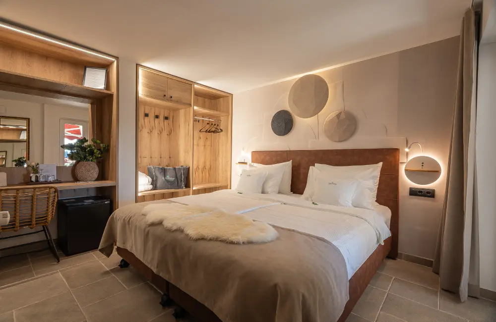 Tara Deluxe Suite bedroom with king bed, Villa Bellevue Portorož