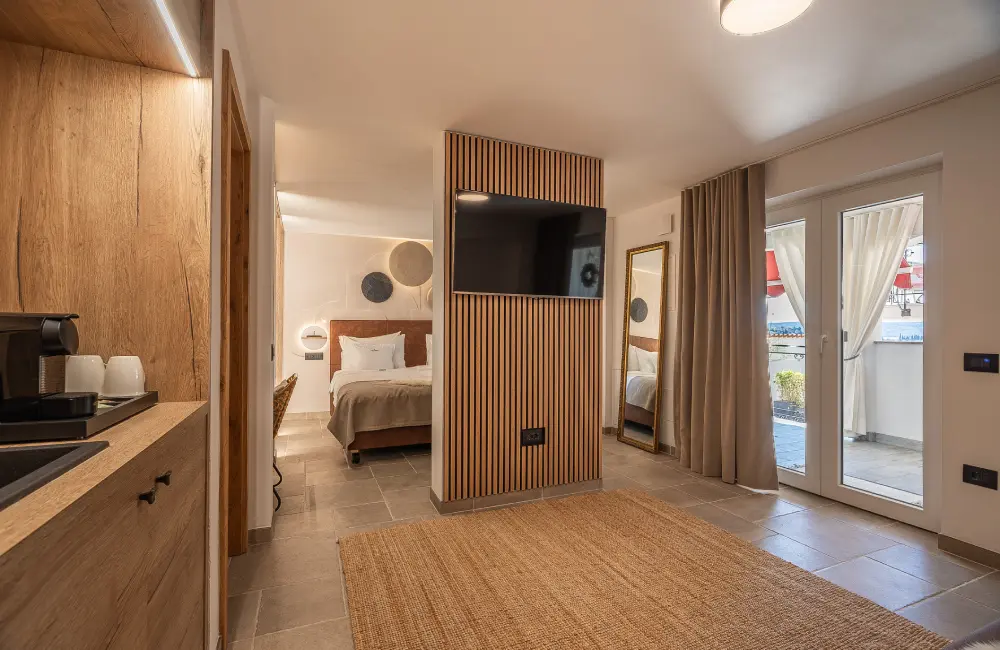 Tara Deluxe Suite bedroom with king bed, Villa Bellevue Portorož